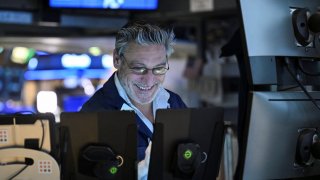 A trader works on the floor of the New York Stock Exchange during afternoon trading on April 9, 2025 in New York.