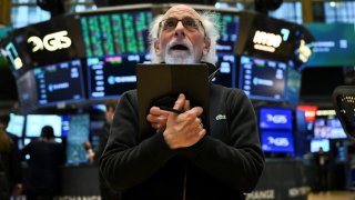 A trader works on the floor of the New York Stock Exchange during afternoon trading on April 9, 2025 in New York.