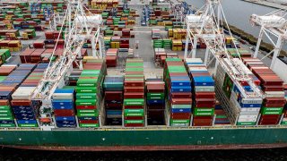 A cargo ship carrying shipping containers is moored to the pier at the Port of Baltimore on April 10, 2025, in Baltimore, Maryland.