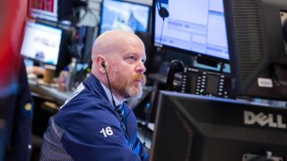 Traders work on the floor of the New York Stock Exchange on April 10, 2025.