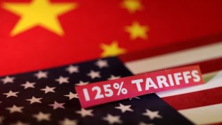U.S. and Chinese flags and a “125% tariffs” label are seen in this illustration taken April 10, 2025. 