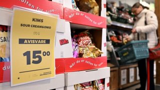 This photograph taken on March 18, 2025 at a Netto discount supermarket in Copenhagen shows a price tag marked with a black star to help consumers identify and buy European-produced groceries as some activists call for a boycott of goods and services made in the US to protest US President Trump’s policies.