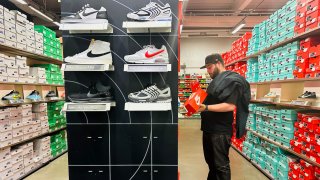 A man shops for shoes at a Nike outlet store in Los Angeles, California on April 10, 2025.