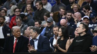 From left, U.S. President Donald Trump, Senator Dave McCormick, his wife Dina Powell McCormick and Elon Musk watch the men’s NCAA wrestling competition at the Wells Fargo Center in Philadelphia, Pennsylvania, on March 22, 2025.
