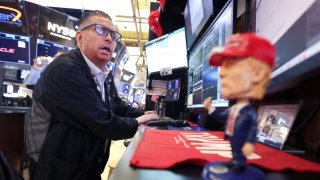 Traders work on the floor of the New York Stock Exchange (NYSE) at the opening bell in New York City, on April 14, 2025. 