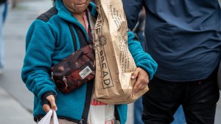 A shopper at a farmer’s market in San Francisco, California, U.S., on Thursday, March 27, 2025.