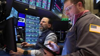 A trader works on the floor at the New York Stock Exchange on April 15, 2025.