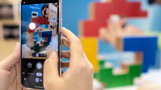 An attendee takes a photograph using a Google Pixel 9 smartphone during the CP+ trade show in Yokohama, Japan on February 27, 2025.