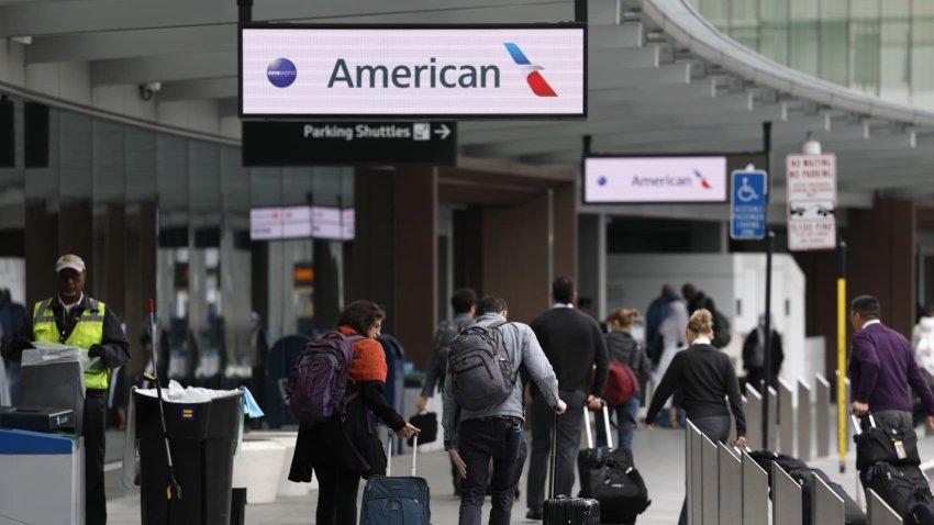 Passengers arrive at the American Airlines terminal at San Francisco International Airport in San Francisco on April 24, 2025.
