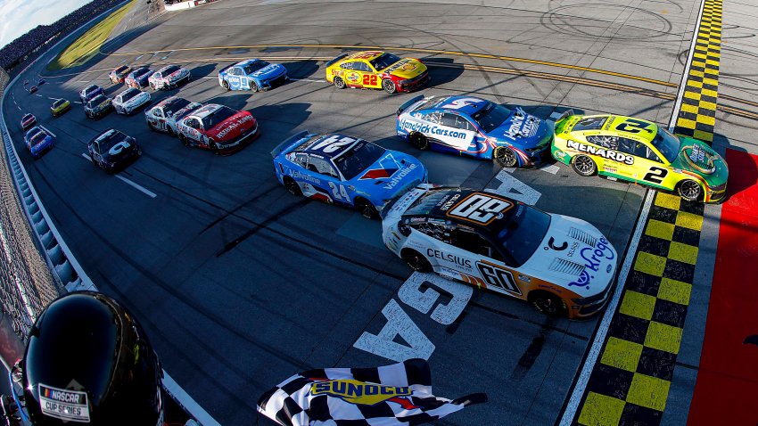 Austin Cindric, driver of the No. 2 Ford, takes the checkered flag to win
