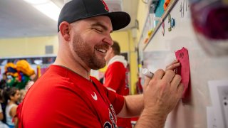 BOSTON, MA – DECEMBER 4: Liam Hendriks #31 of the Boston Red Sox greets students during a visit to the Hurley K-8 School as part of the 2024 Boston Red Sox Holiday Caravan on December 4, 2024 in Boston, Massachusetts. (Photo by Billie Weiss/Boston Red Sox/Getty Images)