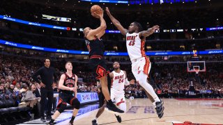 CHICAGO, ILLINOIS – APRIL 16: Talen Horton-Tucker #22 of the Chicago Bulls takes a shot over Davion Mitchell #45 of the Miami Heat during the second half of an NBA play-in tournament game at the United Center on April 16, 2025 in Chicago, Illinois. NOTE TO USER: User expressly acknowledges and agrees that, by downloading and or using this photograph, User is consenting to the terms and conditions of the Getty Images License Agreement. (Photo by Justin Casterline/Getty Images)