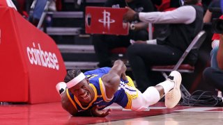 Golden State Warriors’ Jimmy Butler III writhes in pain after injuring himself in 1st quarter against Houston Rockets in Game 2 of First Round of NBA Playoffs at Toyota Center in Houston, Texas on Wednesday, April 23, 2025. (Photo by Scott Strazzante/San Francisco Chronicle via Getty Images)