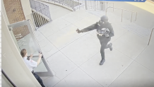 Surveillance footage shows a man in a helmet and gas mask pepper-spraying a court officer at Woburn District Court on Monday, April 14, 2025.