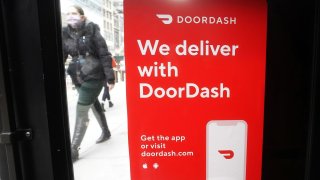 A DoorDash sign is pictured on a restaurant on the day they hold their IPO in New York, December 9, 2020.