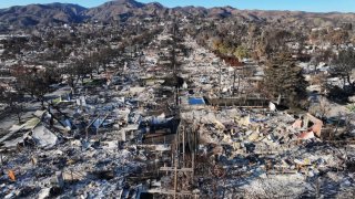 An aerial view of homes destroyed in the Palisades Fire on January 27, 2025 in Pacific Palisades, California.