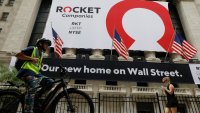 FILE PHOTO: A banner celebrating Rocket Companies Inc., the parent company of U.S. mortgage lender Quicken Loans, IPO is seen on the front facade of the New York Stock Exchange in New York City, U.S., August 6, 2020.