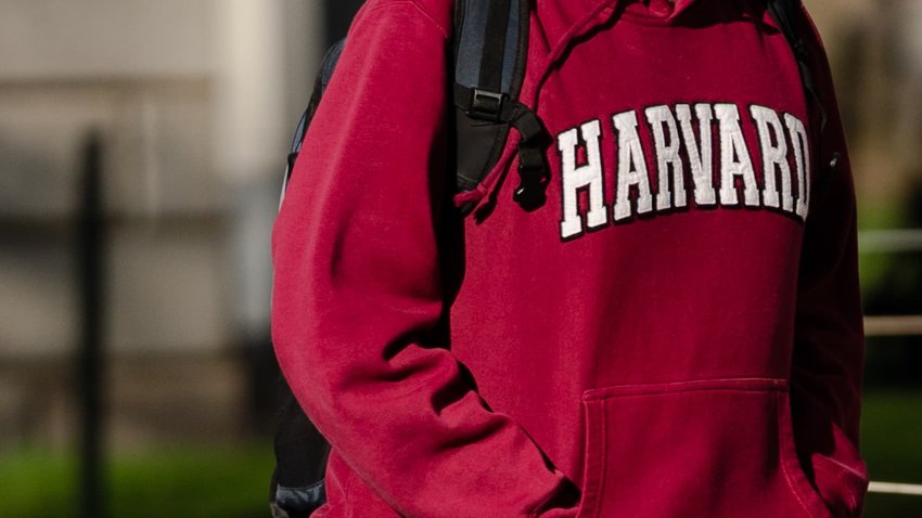 A pedestrian wearing a Harvard University sweatshirt on the Harvard University campus in Cambridge, Massachusetts, US, on Wednesday, April 16, 2025.