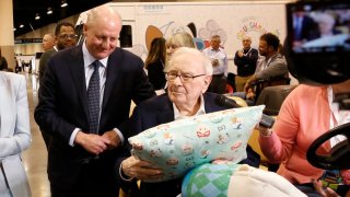Warren Buffett and Greg Abel walkthrough the Berkshire Hathaway Annual Shareholders Meeting in Omaha, Nebraska on May 3, 2025.