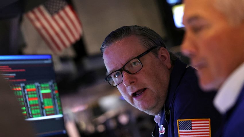 Traders work on the floor at the New York Stock Exchange in New York City, U.S., May 7, 2025.