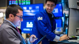 Traders work at the New York Stock Exchange on May 9, 2025.
