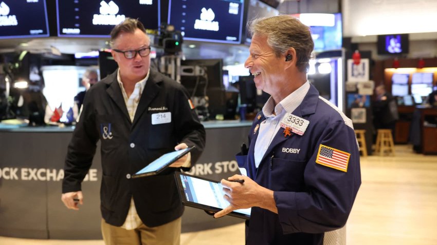 Traders work on the floor at the New York Stock Exchange (NYSE) in New York City, U.S., May 12, 2025.