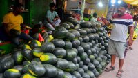 Indian shopkeepers sell summer fruit watermelons at their roadside stalls in a market area in Siliguri, India on May 2, 2025.
Watermelon is a very popular fruit during the summer season.