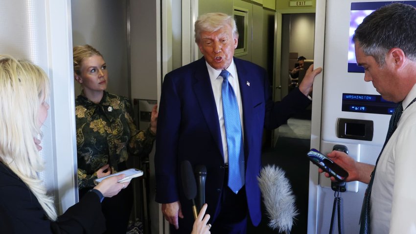 U.S. President Donald J. Trump speaks to media on Air Force One as he departs the Al Bateen Executive Airport on May 15, 2025, in Abu Dhabi, United Arab Emirates.