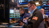 Traders work on the floor of the New York Stock Exchange (NYSE) on May 19, 2025 in New York City.