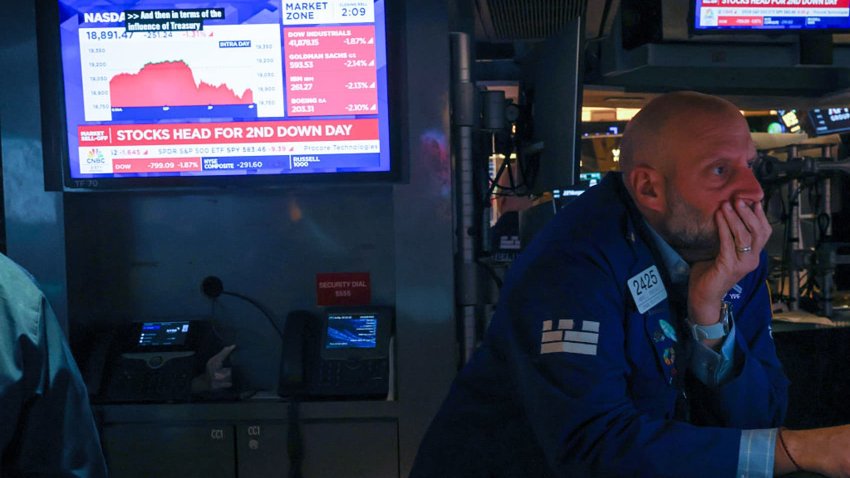 Traders work on the floor of the New York Stock Exchange on May 21, 2025, in New York City.