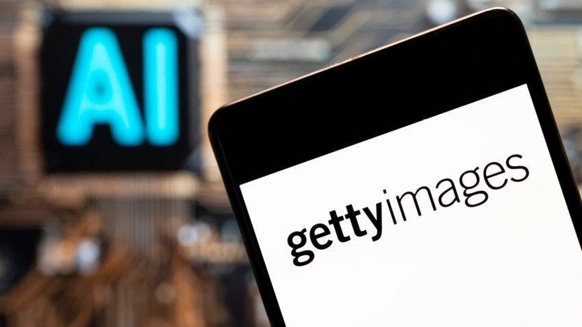 Getty Images’ logo seen displayed on a smartphone with an AI chip and symbol in the background.