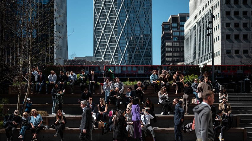 LONDON, ENGLAND – APRIL 7: People enjoy their lunch in the sunshine in London’s Canary Wharf business district on April 7, 2025 in London, England. (Photo by Carl Court/Getty Images)