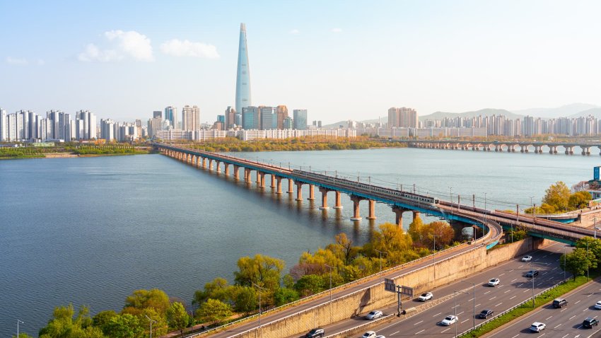 Gyeonggi Province Bridge Over River With Buildings Against Sky, South Korea