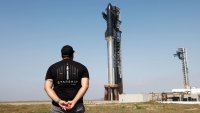 Matt Farrah of Newcastle, Australia views SpaceX’s next-generation Starship spacecraft atop its Super Heavy booster is prepared for launch on its ninth test at the company’s launch pad in Starbase, Texas, U.S., May 27, 2025.
