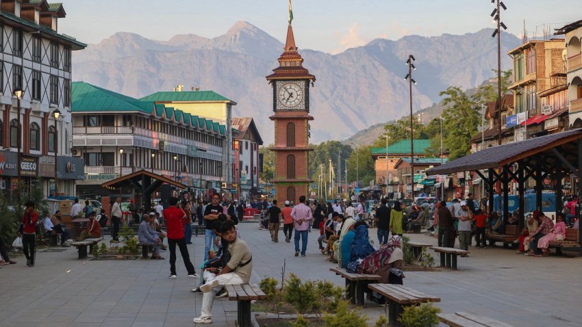Indian tourists and Kashmiris walk near the clock tower (Ghanta Ghar) in Srinagar, Jammu and Kashmir, on May 28, 2025.