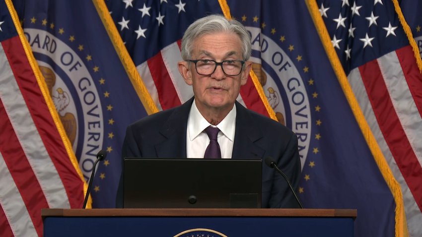 Fed Chair Jerome Powell speaking at a news conference.