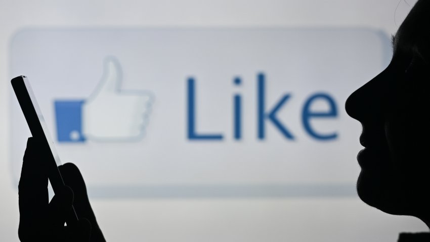 An image of a woman holding a cell phone in front of a LIKE symbol