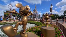 ORLANDO, FL - APRIL 3: Statues of Mickey Mouse and Minnie Mouse stand in a garden in front of Cinderella's Castle at the Magic Kingdom Park at Walt Disney World on April 3, 2025, in Orlando, Florida. (Photo by Gary Hershorn/Getty Images)