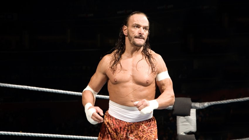 Sabu looks on while in the ring
