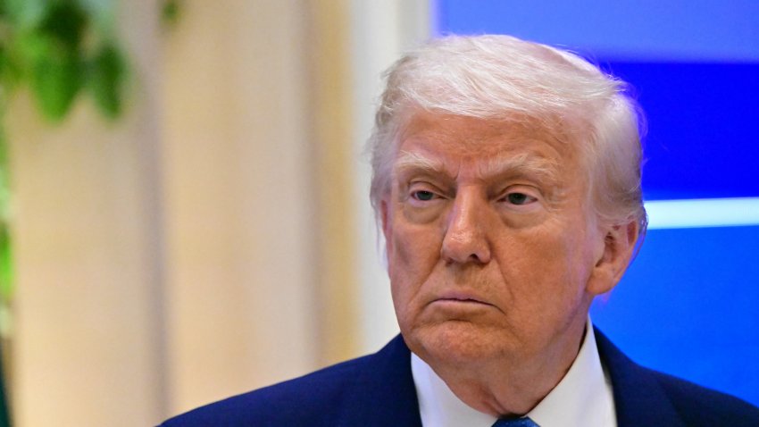 US President Donald Trump attends a business forum in Abu Dhabi on May 16, 2025. Trump capped his Gulf tour in Abu Dhabi after signing another raft of multi-billion-dollar deals, while also securing a $1.4 trillion investment pledge from the UAE.