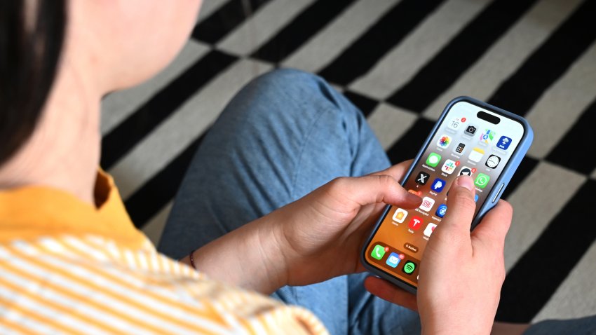 A teenager using a smartphone
