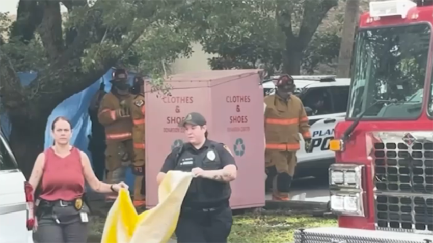 A death investigation was underway in Plantation after a woman’s body was found inside a clothing donation box Friday morning.