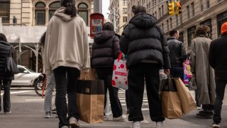 Shoppers carrying bags in the Soho neighborhood of New York, US, on Wednesday, March 26, 2025.