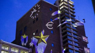 A projected illumination marking the 75th anniversary of the Schuman Declaration, on the Grossmarkthalle building at the European Central Bank headquarters in Frankfurt, Germany, on May 9, 2025.