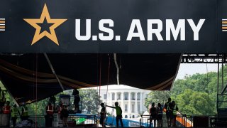 Workers set up the reviewing stand in front of the White House on Tuesday, June 10, 2025, for the U.S. Army’s 250th anniversary parade.