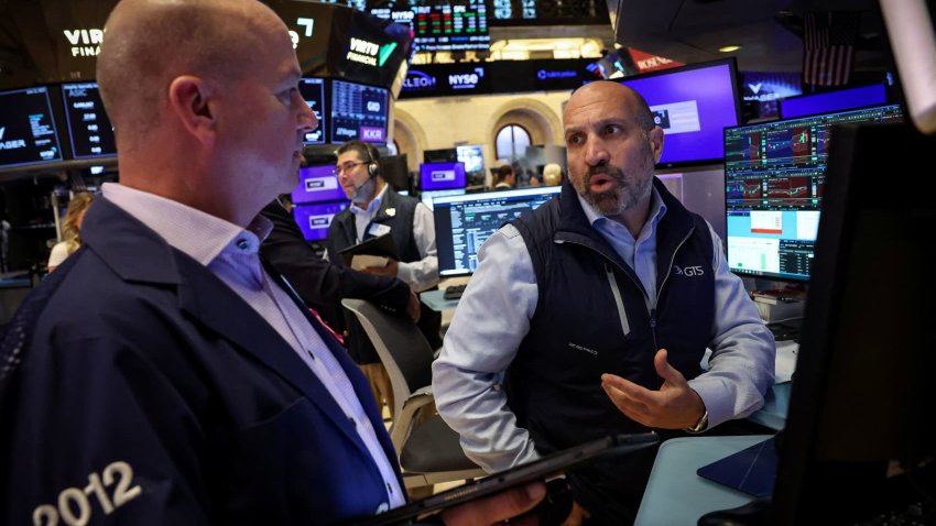 Traders work on the floor at the New York Stock Exchange (NYSE) in New York City, U.S., June 11, 2025.