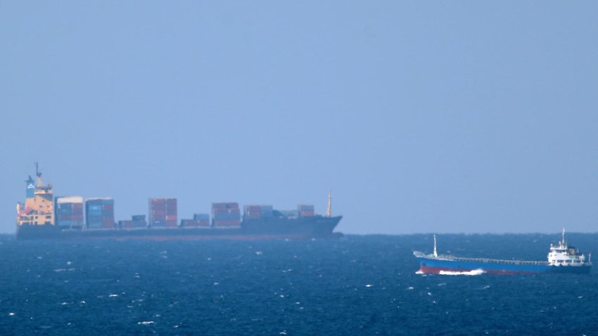 A cargo ship cruises toward the Strait of Hormuz off the shores of Khasab in Oman on Jan. 15, 2011.