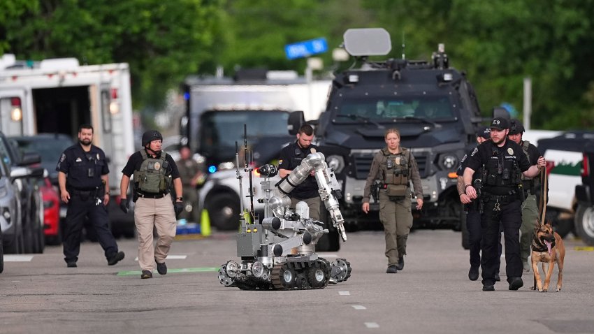 Law enforcement officials investigate after an attack on the Pearl Street Mall Sunday, June 1, 2025, in Boulder, Colo.