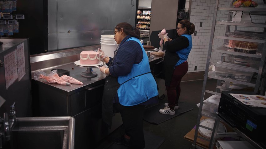 Employees make cakes inside Walmart Supercente