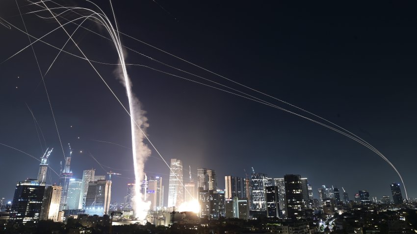 Israeli Iron Dome air defense system fires to intercept missiles over Tel Aviv, Israel, Friday, June 13, 2025.